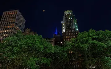 American Radiator Building with full moon, New York, U.S.A.